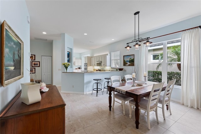 dining room with baseboards, light tile patterned flooring, visible vents, and recessed lighting