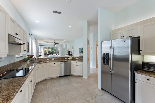 kitchen with light tile patterned floors, a sink, a ceiling fan, appliances with stainless steel finishes, and under cabinet range hood