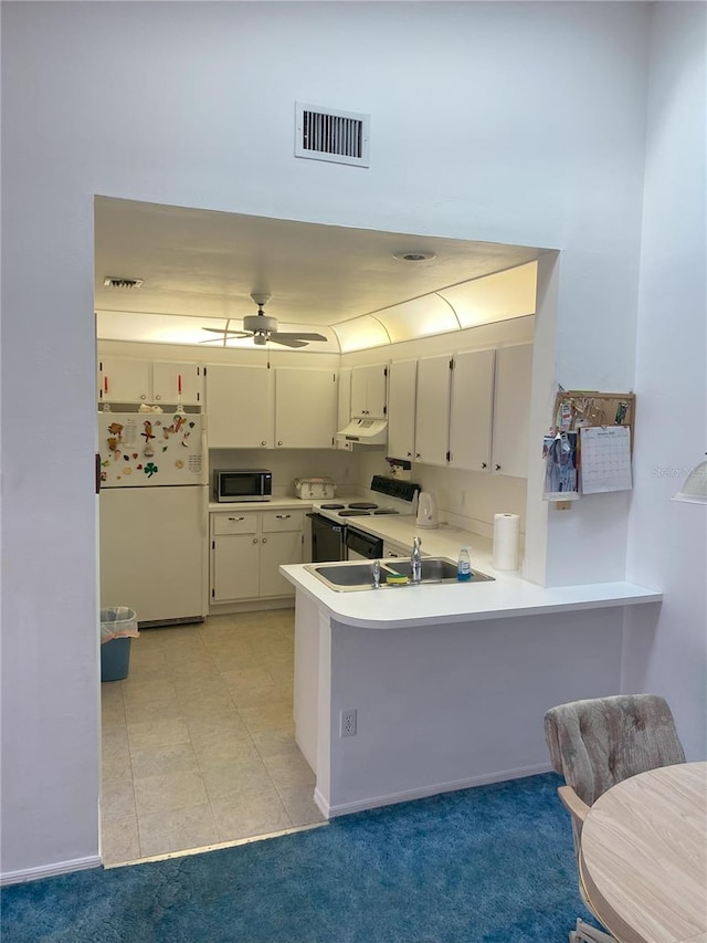 kitchen featuring white cabinetry, light tile patterned floors, ceiling fan, kitchen peninsula, and white appliances