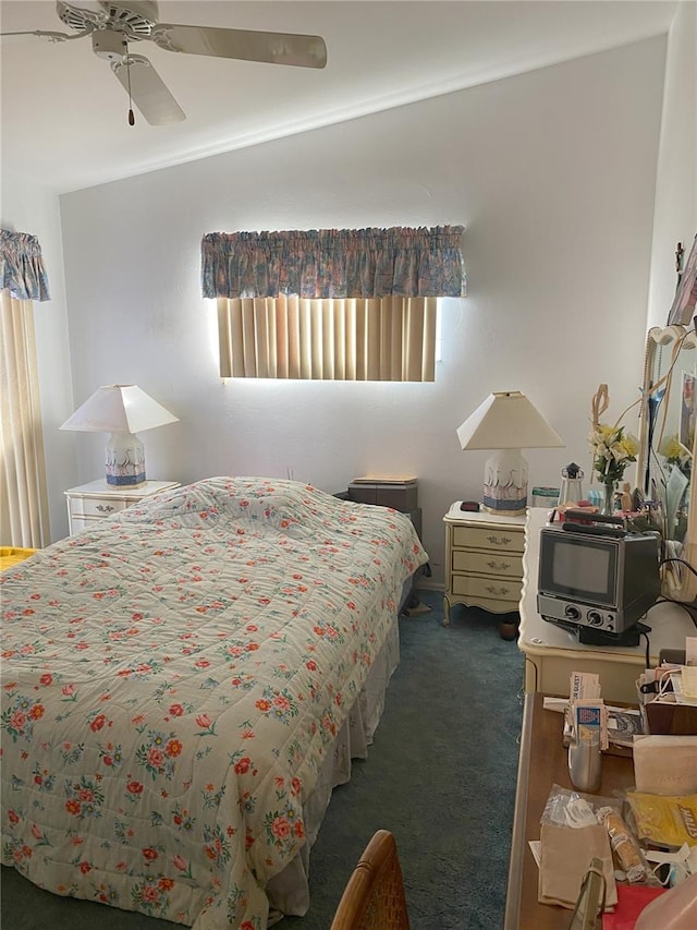 carpeted bedroom with multiple windows and ceiling fan