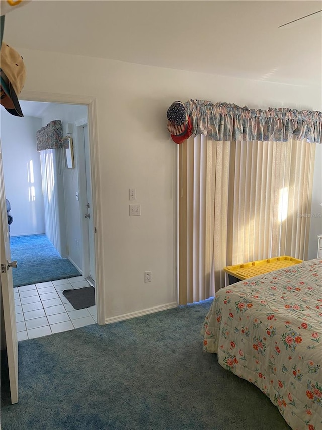 carpeted bedroom with multiple windows