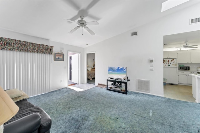 living area featuring light carpet and visible vents