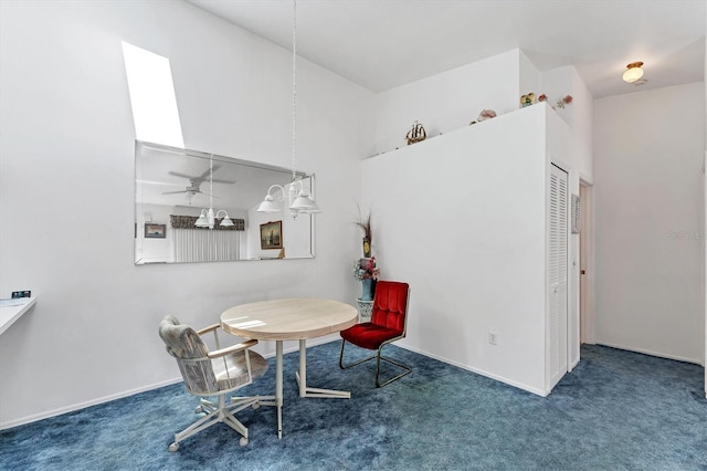 dining area with dark colored carpet and baseboards