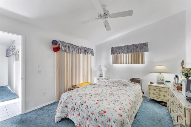 carpeted bedroom with a ceiling fan, lofted ceiling, and baseboards