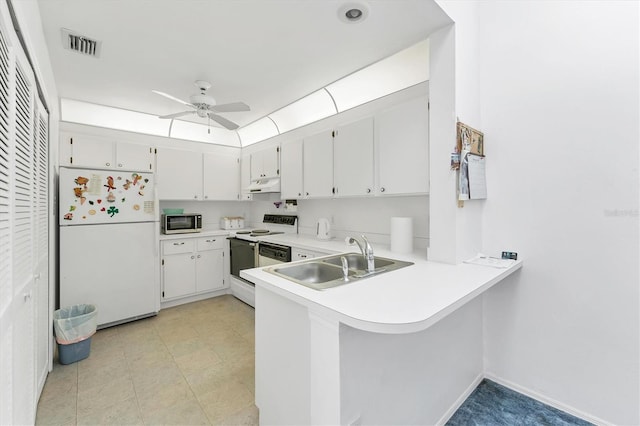 kitchen featuring under cabinet range hood, white appliances, a sink, white cabinetry, and light countertops