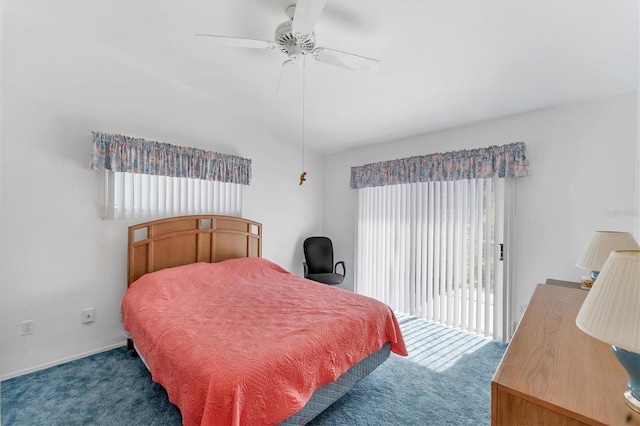 bedroom featuring dark colored carpet, access to outside, multiple windows, and ceiling fan