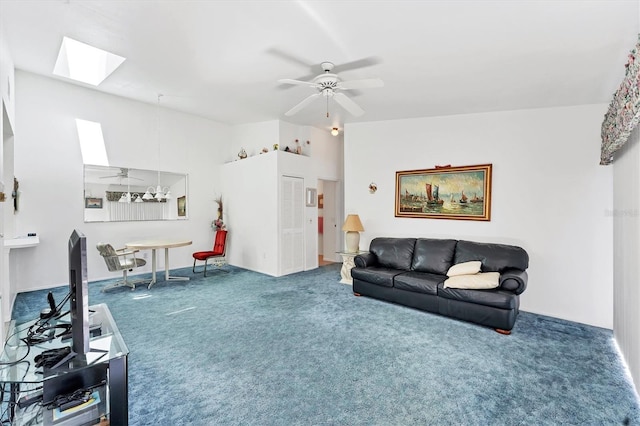 carpeted living room featuring a ceiling fan and a skylight