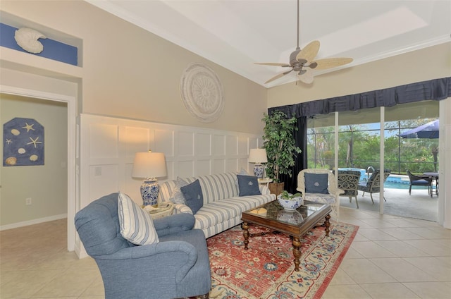 living room featuring ceiling fan, ornamental molding, and light tile patterned floors