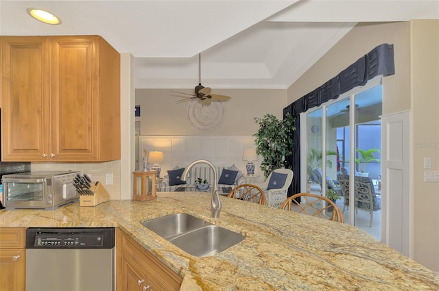 kitchen with dishwasher, sink, backsplash, kitchen peninsula, and crown molding