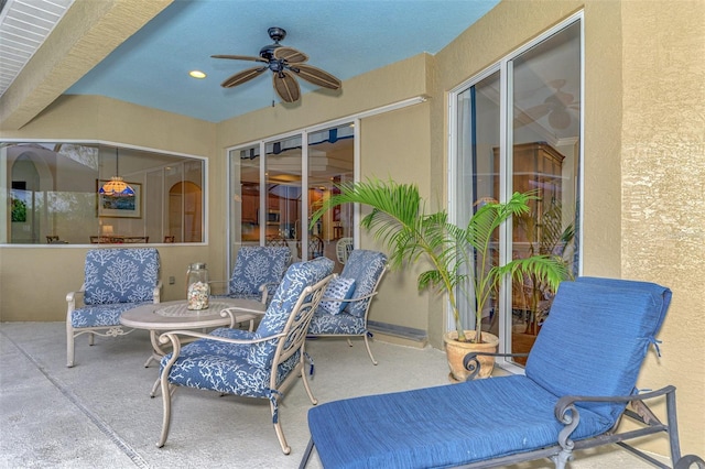 view of patio / terrace featuring ceiling fan