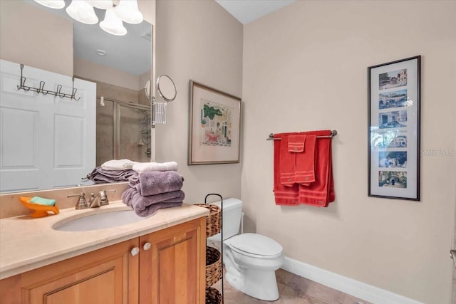 bathroom with walk in shower, tile patterned floors, vanity, and toilet