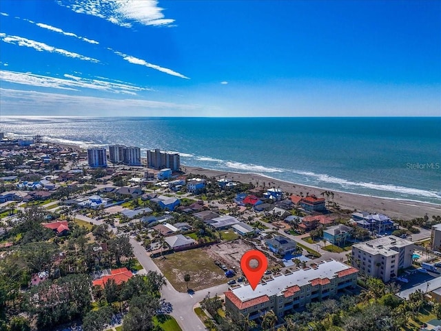 aerial view with a view of the beach and a water view