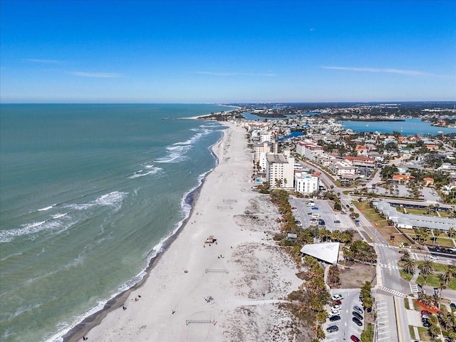 birds eye view of property with a beach view and a water view