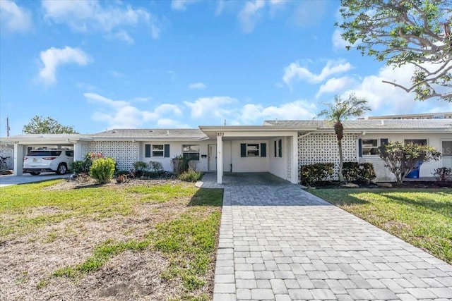 single story home with a carport and a front yard