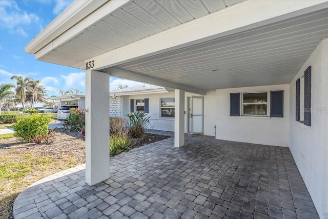 view of patio / terrace with a carport