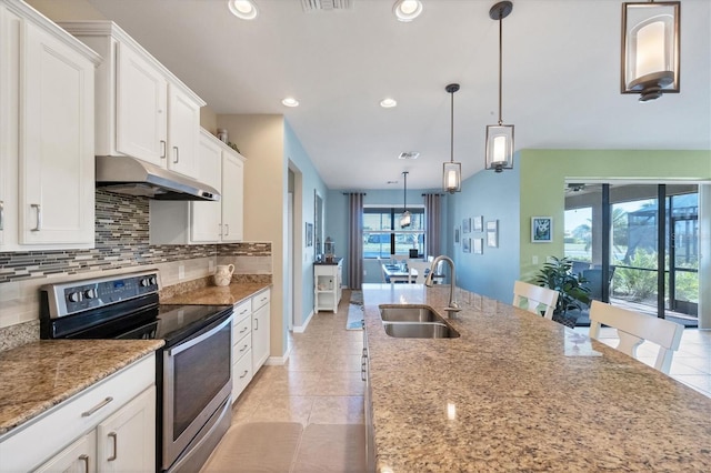 kitchen with sink, white cabinetry, decorative light fixtures, electric range, and light stone countertops