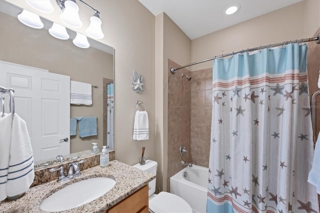 full bathroom with vanity, toilet, and shower / bath combo