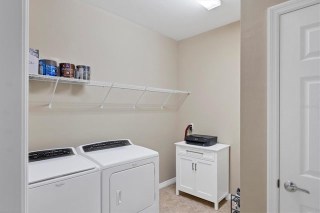 laundry area featuring cabinets and washer and dryer