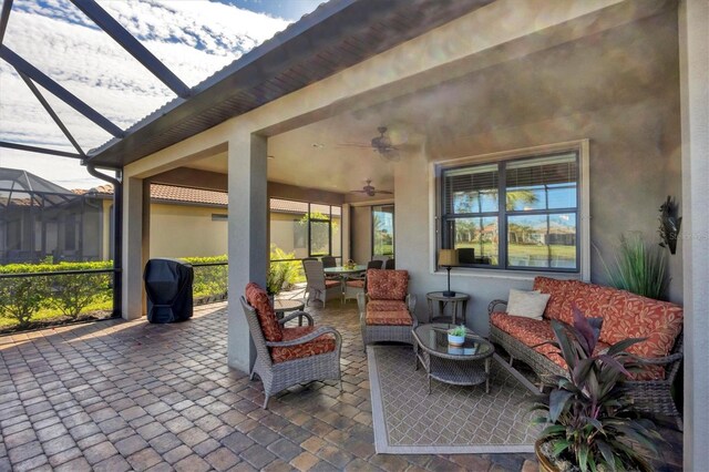 view of patio / terrace featuring an outdoor living space, grilling area, and ceiling fan