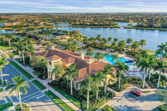 birds eye view of property with a water view