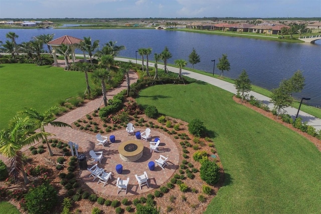 birds eye view of property with a water view