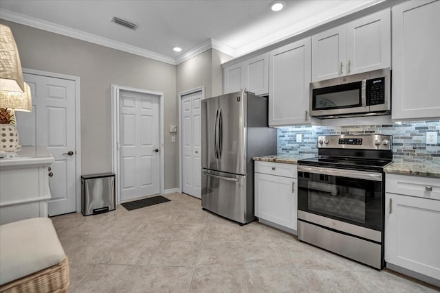 kitchen featuring white cabinetry, crown molding, tasteful backsplash, and appliances with stainless steel finishes