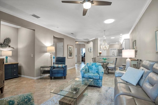 living room with crown molding, sink, and ceiling fan with notable chandelier