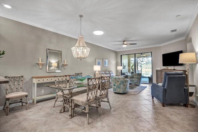 dining room with ornamental molding and ceiling fan with notable chandelier