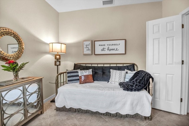 bedroom with tile patterned floors