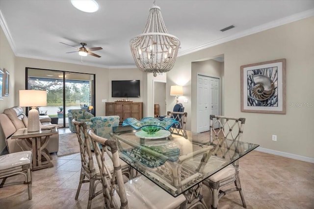 dining space with crown molding, ceiling fan with notable chandelier, and light tile patterned floors