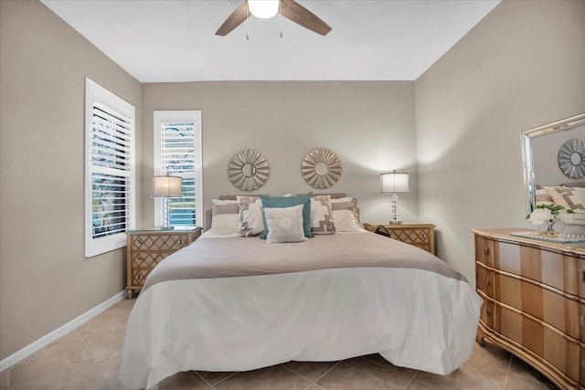 tiled bedroom with ceiling fan