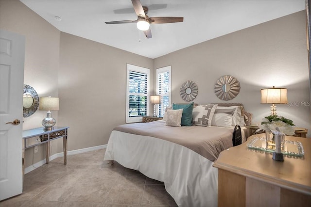 bedroom with ceiling fan and light tile patterned floors