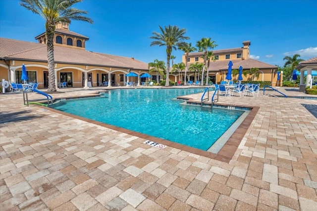 view of swimming pool featuring a patio