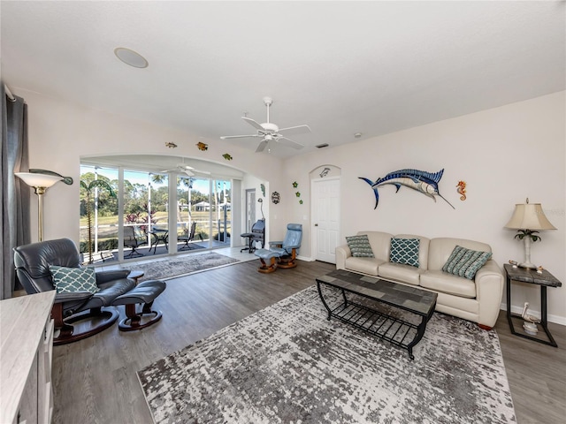 living room with hardwood / wood-style floors and ceiling fan