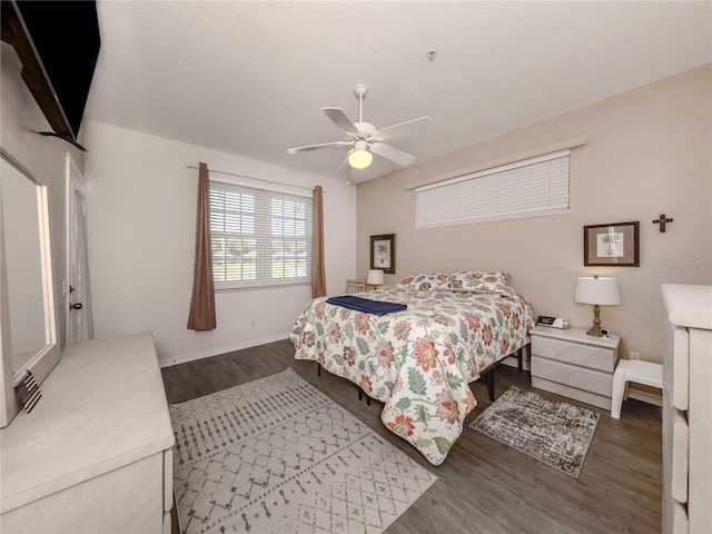 bedroom featuring ceiling fan and dark hardwood / wood-style flooring