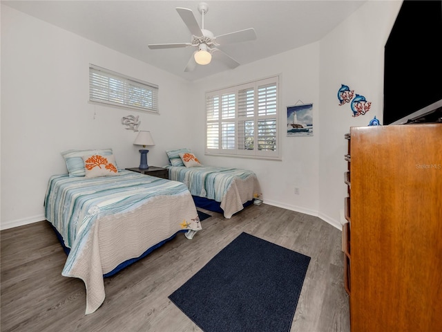 bedroom featuring ceiling fan and wood-type flooring