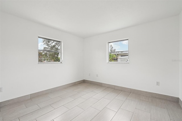 unfurnished room featuring a healthy amount of sunlight