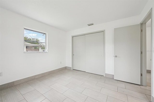 unfurnished bedroom featuring a closet