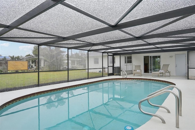 view of pool with a lanai and a patio area