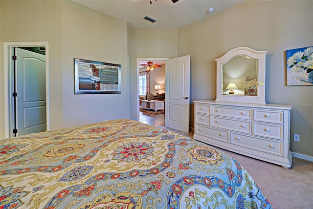 bedroom with light colored carpet