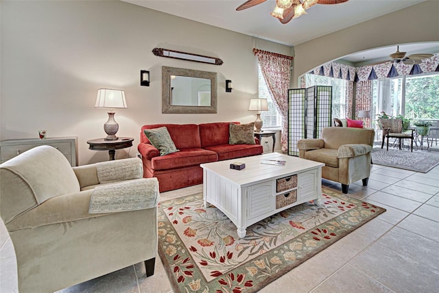 tiled living room with ceiling fan