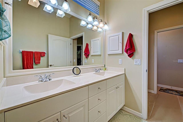 bathroom with tile patterned floors and vanity