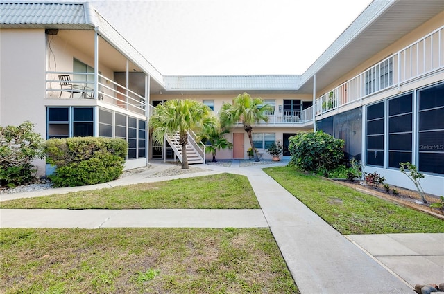 view of home's community with a lawn