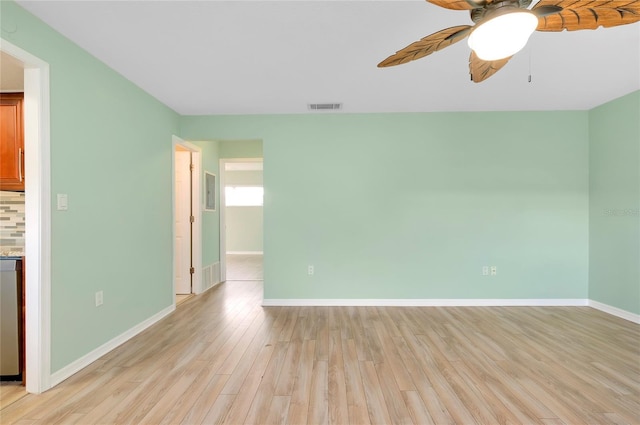 empty room with light hardwood / wood-style floors and ceiling fan