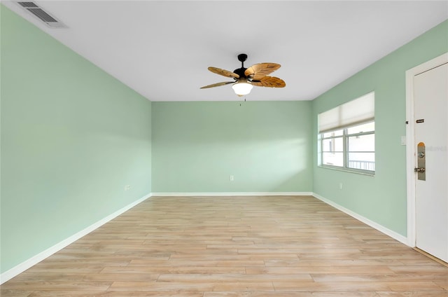 spare room featuring ceiling fan and light wood-type flooring