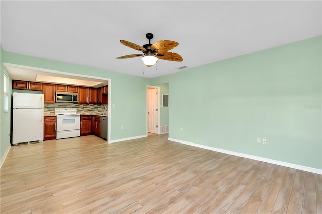 kitchen with tasteful backsplash, appliances with stainless steel finishes, light wood-type flooring, and ceiling fan