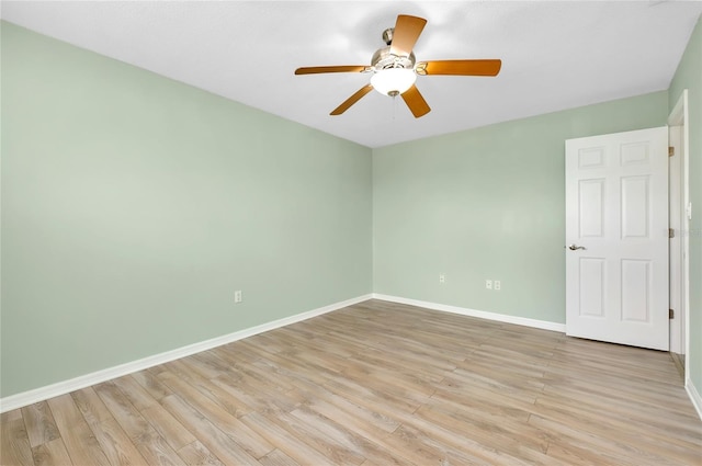 spare room featuring ceiling fan and light wood-type flooring