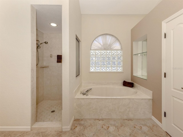 bathroom with shower with separate bathtub