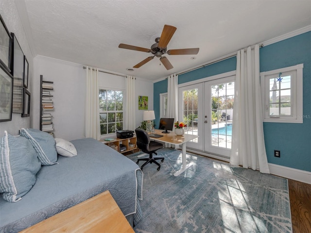 bedroom featuring french doors, wood-type flooring, ornamental molding, ceiling fan, and access to exterior