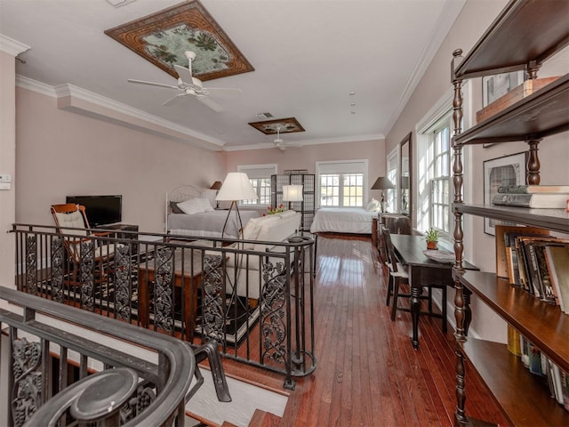 interior space featuring hardwood / wood-style flooring, ceiling fan, and ornamental molding